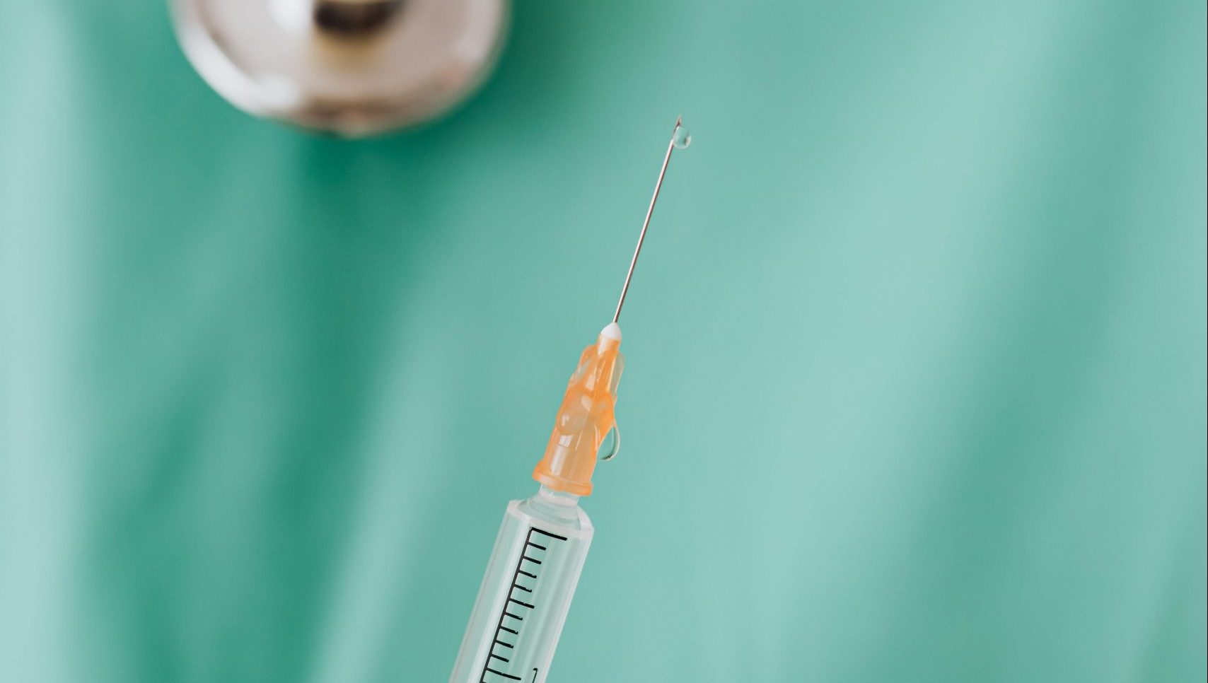 close-up-view-of-person-holding-a-vaccine-4047183