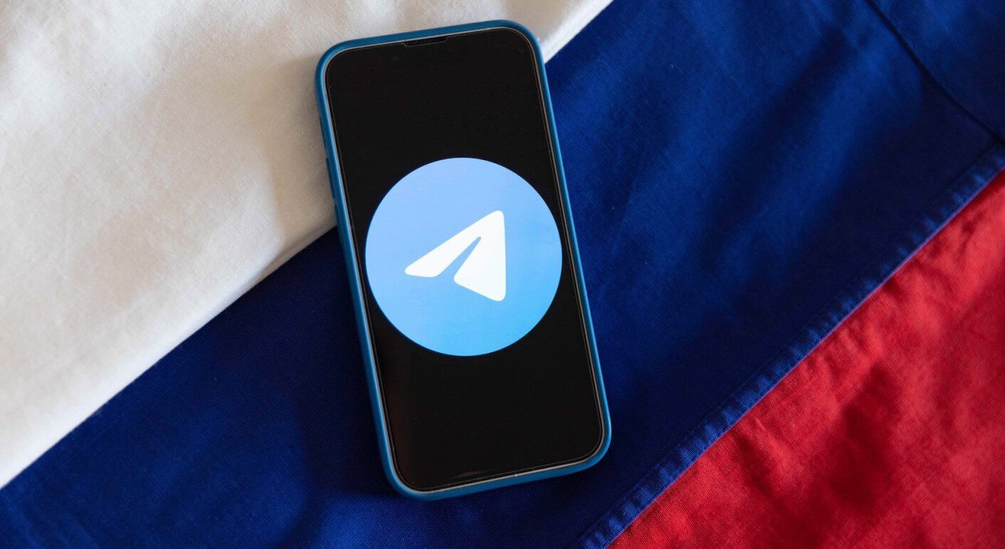 Telegram Messenger App logo with Russian flag.