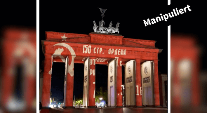 Ein Foto des Brandenburger Tors, das manipuliert wurde: Darauf zu sehen ist die Projektion eines sowjetischen Banners.
